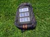 Mini solar panels on a black backpack.