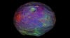 This shot, from a video taken by NASA's Dawn mission, shows Vesta, the giant asteroid, in a new light. It's not really those colors, of course. It's just colored that way to show elevation. Still pretty though. Read more <a href="http://www.jpl.nasa.gov/news/news.cfm?release=2012-156">here</a>.
