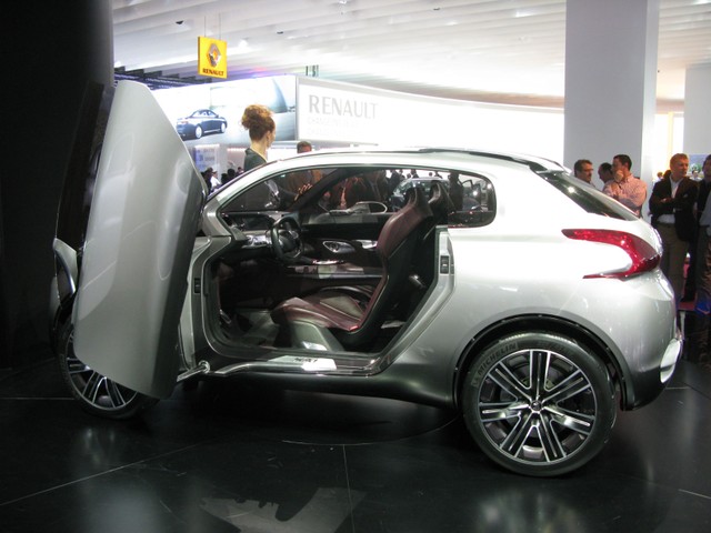 Peugeot showed off their fuel-sipping concept, the 64 mpg HR1, whose Hybrid4 technology uses a 37-bhp electric motor to power the rear wheels and a three-cylinder 1.2-liter gas engine to power the front. Combined horsepower: 147.