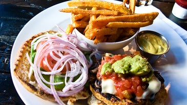 A veggie burger with fries.
