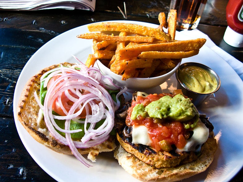 A veggie burger with fries.