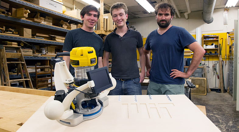 From left to right: Ilan E. Moyer, Alec Rivers, and Frédo Durand with their new woodworking router tool.