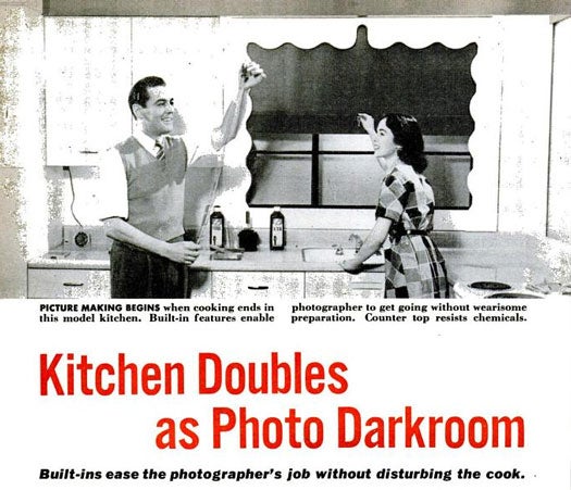 After the war, open-plan, 1 and 1/2 story houses become the norm for families moving out to the suburbs. For amateur photographers, this meant less space to indulge in his hobby. In response to the problem, the General Electric Home Bureau and F-R Corp designed a kitchen could also function as a darkroom. While the combination sounds unlikely, planners took carefully installed a number of "gimmicks" that would let the photographer do his work without interfering with dinner preparations. A heavy green fabric shade could darken the room in broad daylight, while hidden lights beneath the base of a wall cabinet could let photographers replace his wife's regular light bulb with a safelight bulb. A tall cabinet could double as a broom closet and as a space for drying film. When the brooms are removed, a small electric fan heater at the bottom of the cabinet could work on the film. Read the full story in "Kitchen Doubles as a Photo Darkroom"