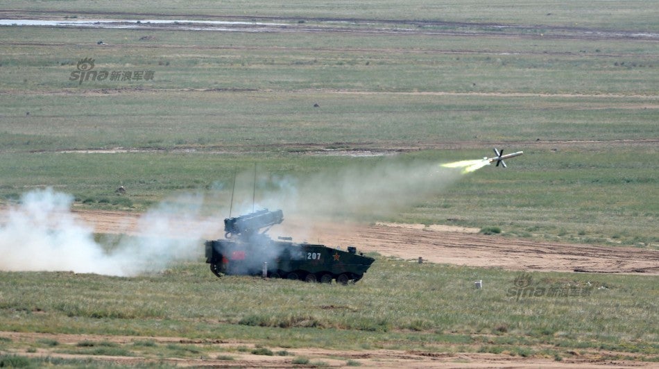 A ZBD-04A anti-tank missile launcher fires a heavy 10km ranged AFT-10 missile (mounting the ATGM launcher on an IFV chassis provides mobility and protection). The wirelessly guided AFT-10 can receive operator corrections to strike at fortified targets like tanks and bunkers, its long range allows the launcher armored vehicle to remain out of danger and provide quick fire support to infantry.