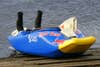 A modified blue kayak with the Red Bull logo and twin air intakes for a jet ski engine.