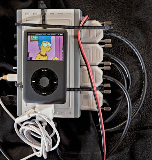 The iPod connects to a circuit board that has a chip normally used to scale down the pixels in surveillance video.