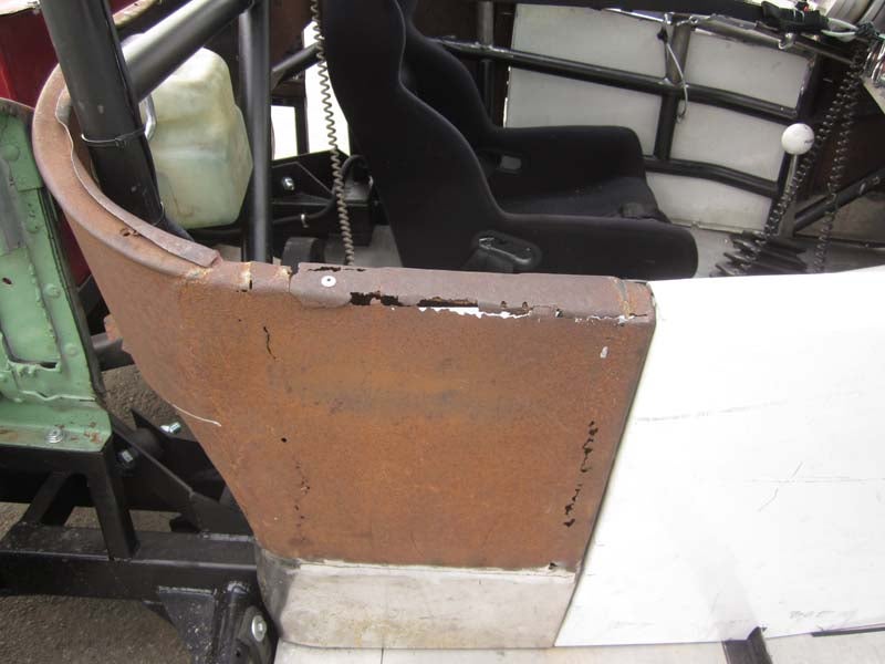 Dave bought a Model A body and frame for $2500 many years back, then sold the body alone for $3500. The '27 Model T body cost him 500 bucks, and a wrecked '86 Mustang was another $200. See how this works? The Mustang provided the engine, transmission, rear end, and rear suspension. The roll cage (which doesn't count against the $500 budget) provides stiffness to the ancient frame, and there's enough money left over for more parts.