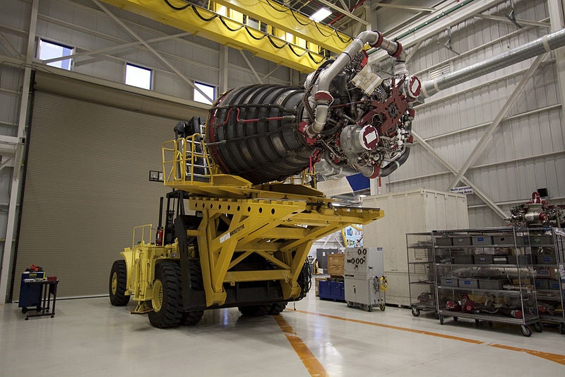 In this image, one of the space shuttles' main engines is being prepared for transport to Orbiter Processing Facility-1. The OPF buildings are basically way stations between the shuttle component facilities and the VAB, where everything comes together. The shuttles and their engines were prepped and maintained in the OPF buildings, which are now available for private bids.