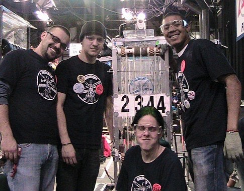 High school students with a homemade robot at the 2009 FIRST Robotics Competition in New York City.