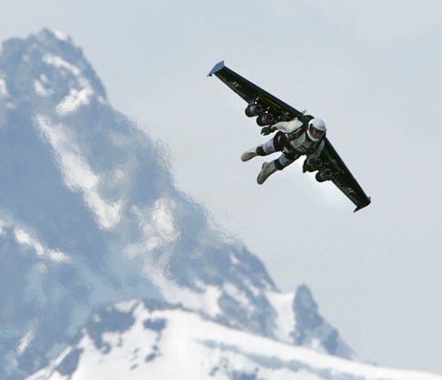 Rossy flies above the southern Swiss Alps, hitting the throttle to gain altitude