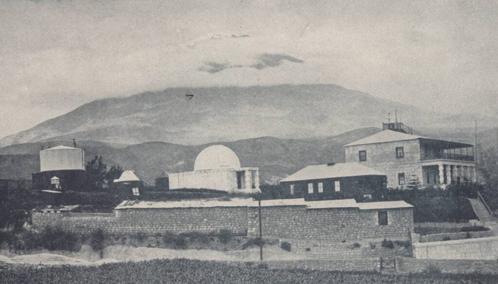 The 24-inch Bruce doublet telescope, one prolific source of astronomical plates, was installed in Cambridge in 1893. It moved to Harvard Boyden Station in Arequipa, Peru, in 1896. This image shows Boyden Station in 1897, with the Bruce building in the center.