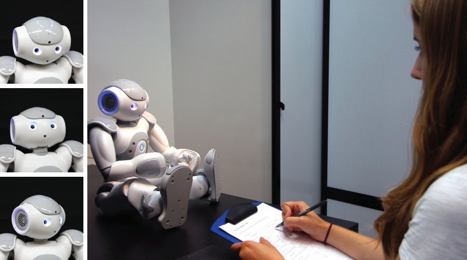 The NAO robot can't move its eyes, so it can't really look away in the manner people do. Researchers programmed it to tilt its head instead.
