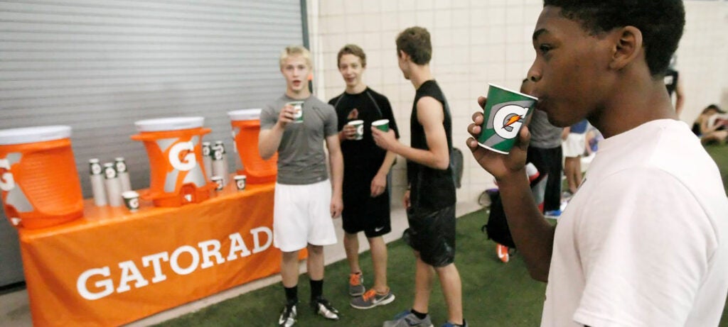 young athletes drinking gatorade