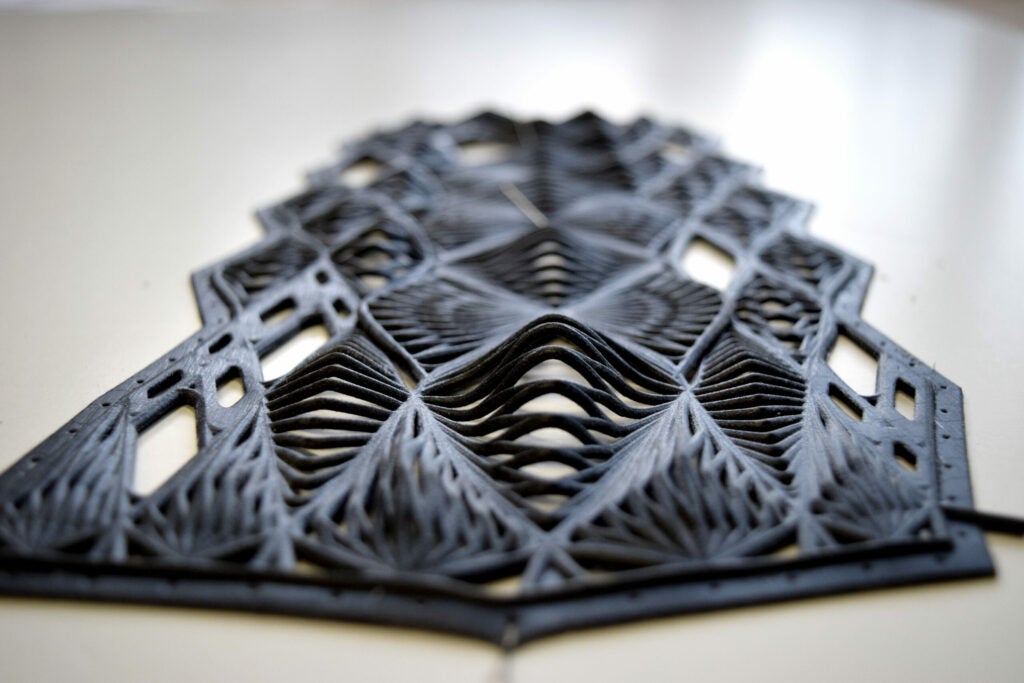 Van Dongen’s first foray into 3D-printed fashion was relatively simple: She made a sleeve. But she wanted the garment to function as more than just a cover, so she tried to give it auxetic behavior, or make it thicken when stretched. With an Objet Connex multi-material printer, van Dongen printed this geometric design--made up of rhomboid-shaped elements--in flexible, rubber-like materials and solid plastics.