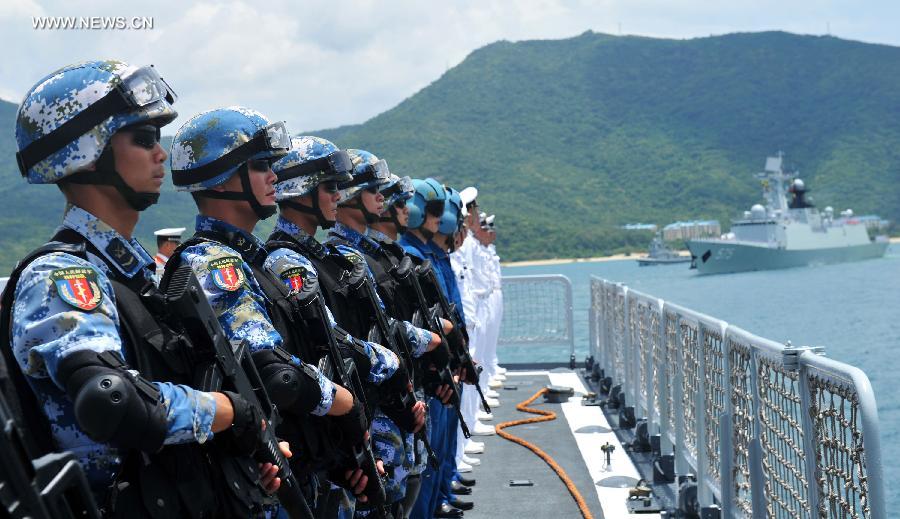 Chinese Marines stand at attention on the Haikou DDG, as the PLAN's RIMPAC 2014 taskforce leaves Hainan. The Marines will likely take part in the interdiction component of RIMPAC 2014.