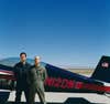 Peter Siebold and Chuck Coleman in front of Coleman's Extra 300, which is used to practice reentries.