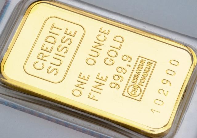 A 1-ounce bar of fine gold, with the Credit Suisse name on it.