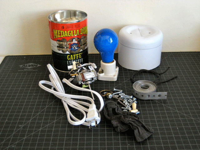 A coffee can, a light bulb, wires, and other materials for building a DIY bug zapper from 1971.