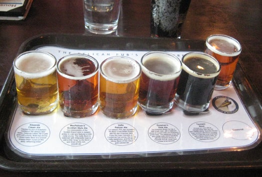The sampler flight from Pelican Pub and Brewery in Pacific City, Oregon, shows the range of colors and opacities beer can have. From left to right, the beer styles are: cream ale, scottish style ale, india pale ale, brown ale, stout, and a seasonal whose identity I cannot remember.