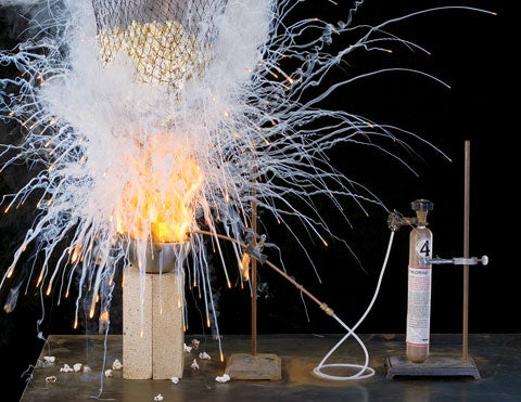 An explosion of fire and smoke creating table salt to season a bag of popcorn in a lab.