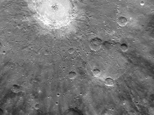 This closeup of the crater Debussy (named for the famous French composer Claude) shows a detail of the "rays" of ejecta and secondary craters that splay outward from the crater's impact site.