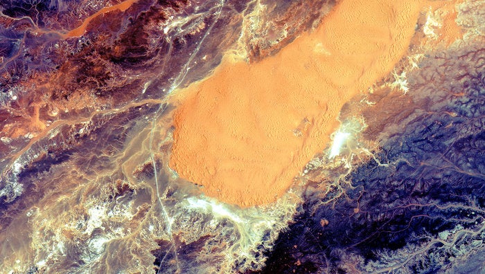 With as punishing as the Sahara Desert is, satellites are probably the best way to study it. The European Space Agency's Sentinel 2A satellite captured <a href="http://gizmodo.com/the-algerian-sahara-looks-stunning-from-orbit-1717234138">this image</a> in the Ghardaïa Province of Algeria, which can help scientists study desert evolution and climate change. You can see a large sand dune in the center of the photo and a line on the left that was once part of the trans-Saharan trade route.