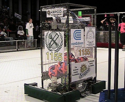 A homemade robot in an arena in front of a crowd at the 2009 FIRST Robotics Competition in New York City.