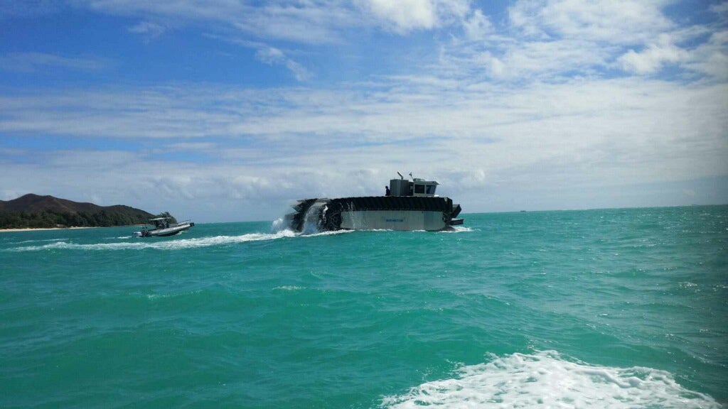 The Ultra Heavy-Lift Amphibious Connector makes its way toward the USS Rushmore to pick up heavy logistics gear and ITV to support operations on Marine Corps Training Area Bellows, Hawaii, during the Marine Corps Warfighting Lab's Advanced Warfare Experiment, July 11, 2014.