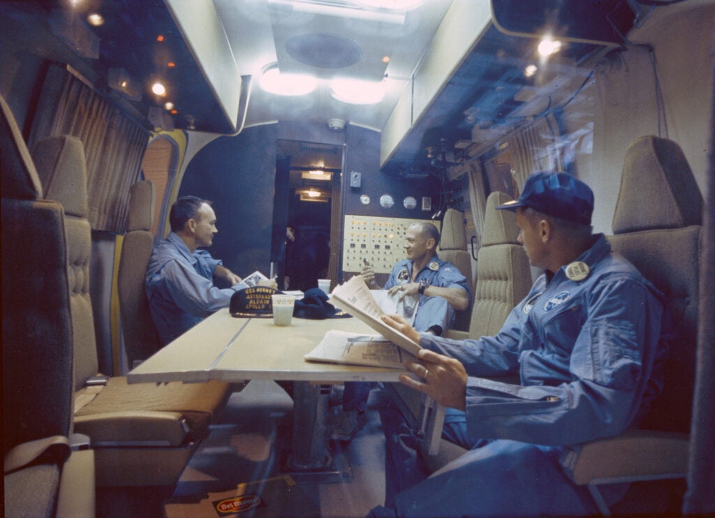 Collins, Aldrin, and Armstrong relaxing in quarantine on board the USS Hornet hours after returning from the Moon.