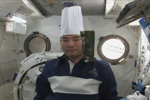 First Soichi Noguchi awed us with his Twitpics; then he kept us entertained by preparing space sushi. Here is with some floating maki. We think Astro Soichi would have made a great roommate.