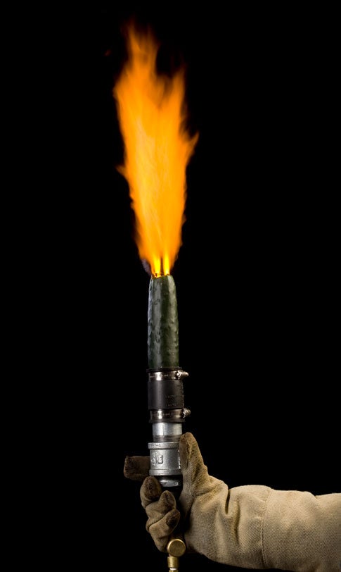 A cucumber on a nozzle shooting flame as a thermal lance.