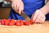 Remove tops, hull, and cut the strawberries into thin slices.