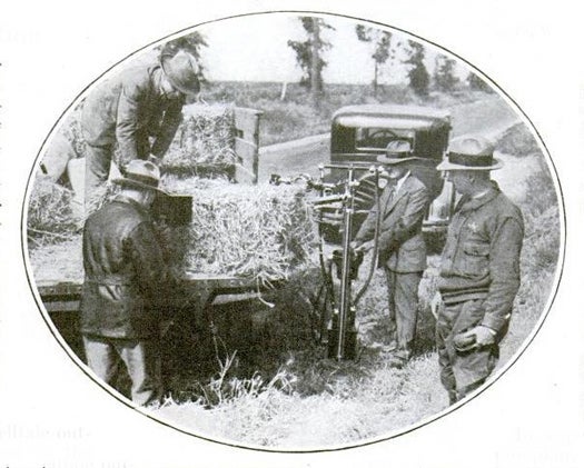Bootleggers weren't the only ones with tricks up their sleeves. George Contreras, Chief Prohibition Agent of LA County, used a portable X-ray machine to detect bottles of whiskey disguised as bales of hay. This photo depicts one man holding the the equipment, which was made specifically for Contreras by an X-ray specialist, while another agent inspects their discovery on a fluoroscope screen. Read the full story in "X-Rays Ferret Out Rum"