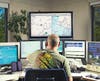 Dispatcher Devon McMahon, at the Santa Cruz Police Department's 911 call center, tracks crimes in real time