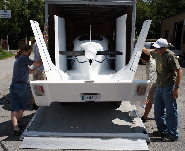 The team loads the Transition into a trailer to take it to an air show.