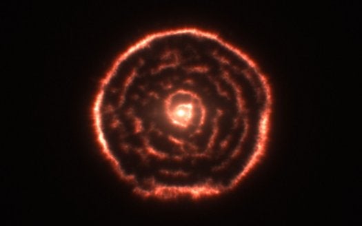 This unexpected spiral is surrounding an asymptotic giant branch star, which the sun will become when it is very old. These dying red giants spew gas and dust as they reach the end of their lives, and sometimes their remnants encircle them in shrouds of dust. But this observation marked the first time anyone saw a strange spiral around such a star. Astronomers using the ALMA telescope believe it was caused by a hidden companion orbiting the dying red giant. In the future, observations with ALMA will help scientists understand how dying stars' remains are spewed into the universe, seeding it with the elements that eventually made their way to our solar system and to us.