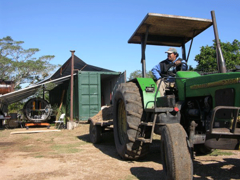 Nacho, the main ranch hand at Rancho la Azufrosa, brings over one of many loads of sand used to level out the â€'bot garage,â€ so sheets of plywood could be laid down to serve as a surface for maneuvering the bot. The lower portion of its orange frame rides on four heavy shop casters, but these need a flat surface to work on.