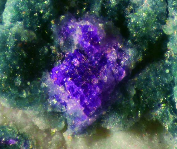 Crystals of putnisite, in purple.