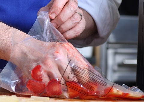 Remove the strawberry slices from the bag, and cut them into cubes.