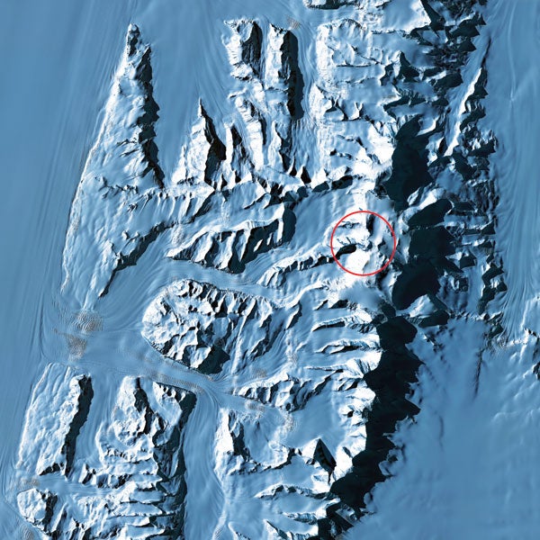 The highest peaks of Antarctica's Ellsworth Mountains, led by the 16,066-foot Vinson Massif [in circle], poke through a blanket of ice created by the confluence of many small glaciers that make up the famed Ronne Ice Shelf. Constant frigid temperatures prevent the ice from ever melting. Instead, the glaciers continue all the way to the sea, their white surfaces broken only where the ice has pressed down over a sharp ridge. There, the ice splits and creates crevasses averaging 150 feet deep.