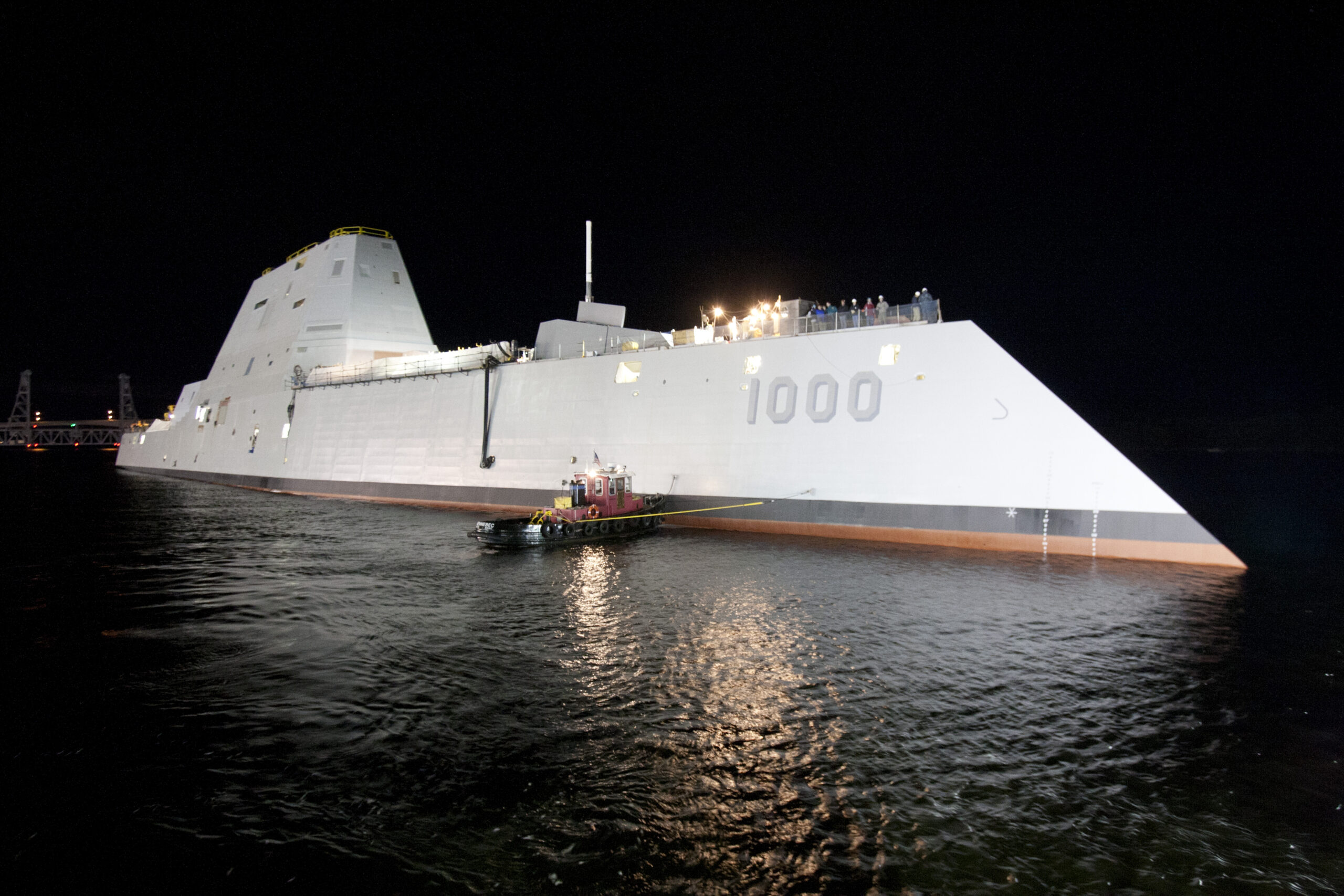 131028-O-ZZ999-103 BATH, Maine (Oct. 28, 2013) The Zumwalt-class guided-missile destroyer DDG 1000 is floated out of dry dock at the General Dynamics Bath Iron Works shipyard. The ship, the first of three Zumwalt-class destroyers, will provide independent forward presence and deterrence, support special operations forces and operate as part of joint and combined expeditionary forces. The lead ship and class are named in honor of former Chief of Naval Operations Adm. Elmo R. "Bud" Zumwalt Jr., who served as chief of naval operations from 1970-1974. (U.S. Navy photo courtesy of General Dynamics/Released)
