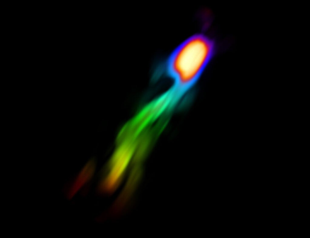 This image shows a jet of gas <a href="http://www.newscientist.com/article/dn26664-giant-galactic-gas-blow-out-seen-for-the-first-time.html#.VI7zTSvF8sJ">forced out of a distant galaxy</a> by the pressure of stars forming in its core.