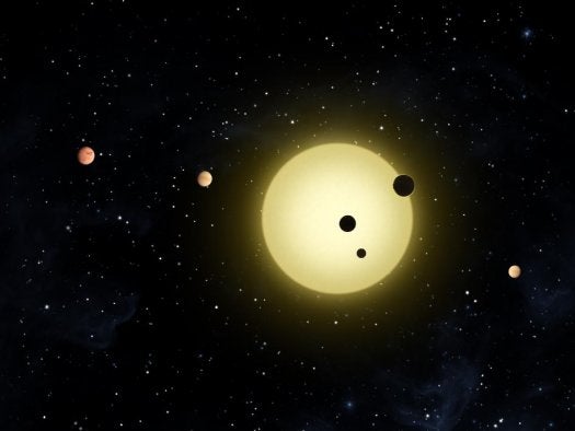 This system includes a sun-like star with six planets tightly orbiting it. At times, two or more planets pass in front of the star at once, as shown in this artist's conception of a simultaneous transit of three planets. This event was observed by the Kepler spacecraft on Aug. 26, 2010. Kepler-11 is located 2,000 light years from Earth.