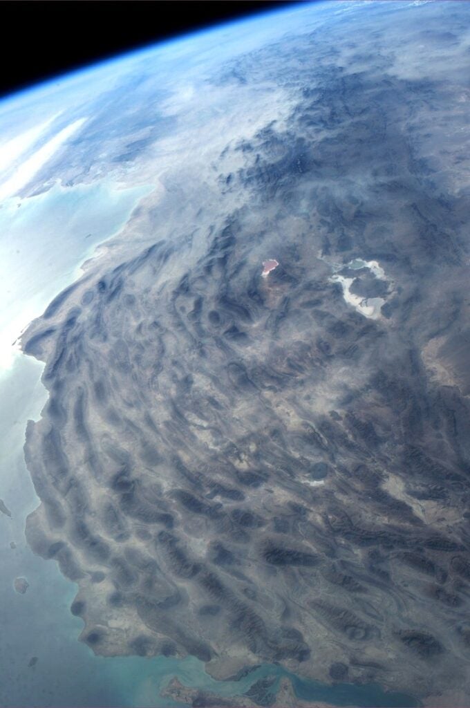 This swirly looking coastal region is Iran along the Persian Gulf.