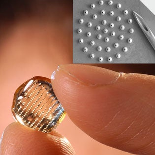 Georgia Tech researcher Mark Prausnitz holds an array of 400 microneedles designed to punch tiny holes in the outer layer of the skin. Inset: a ring of microneedles, each with a 75-micron-wide tip, next to a typical hypodermic, which is six times as wide.