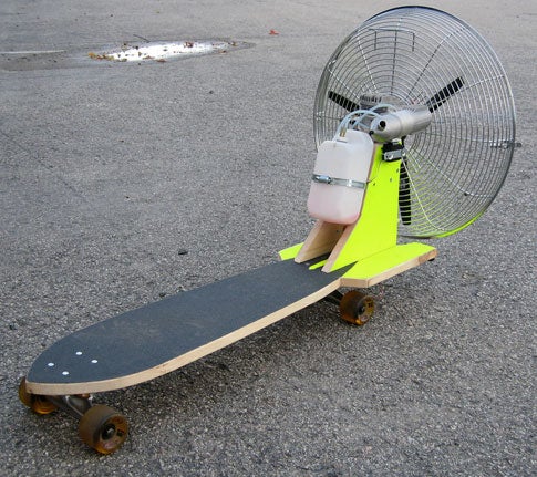 A skateboard with a fan attached to the back.