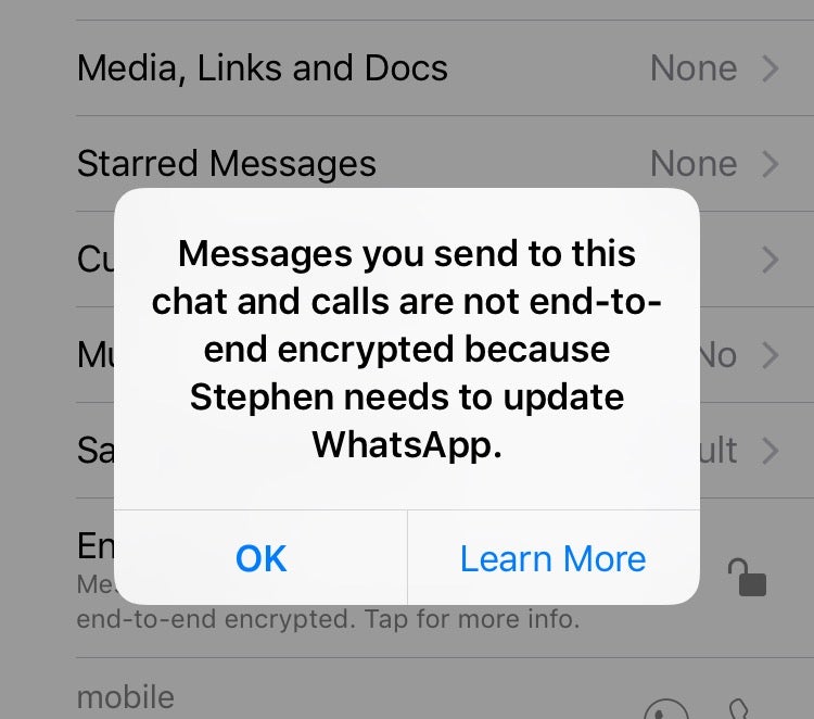 A screenshot of the WhatsApp dialogue saying a chat is not encrypted.