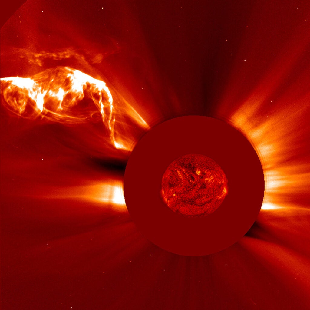 In late April, a long filament in the Sun erupted into a large burst of bright plasma. A solar filament is an <a href="http://www.nasa.gov/image-feature/bright-filament-eruption">unstable strand of solar material</a> suspended above the Sun because of magnetic forces, and this one is unusually long--it extends almost half the length of the sun's visible hemisphere, in fact. This image was taken by a coronagraph instrument, which creates an artificial eclipse by blocking the light from the sun with an occulter disk. You can see the eclipse at the center, as well as the coronal mass ejection in the upper left corner.