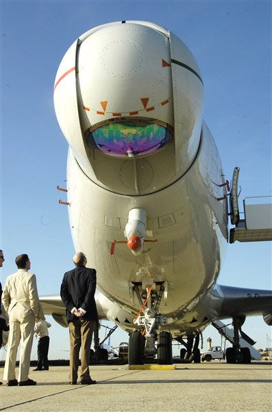 people looking at the grounded Airborne Laser