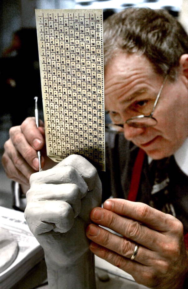 A man examines one of the irregular Florida ballots that lay at the center of the Bush-Gore controversy in 2000.